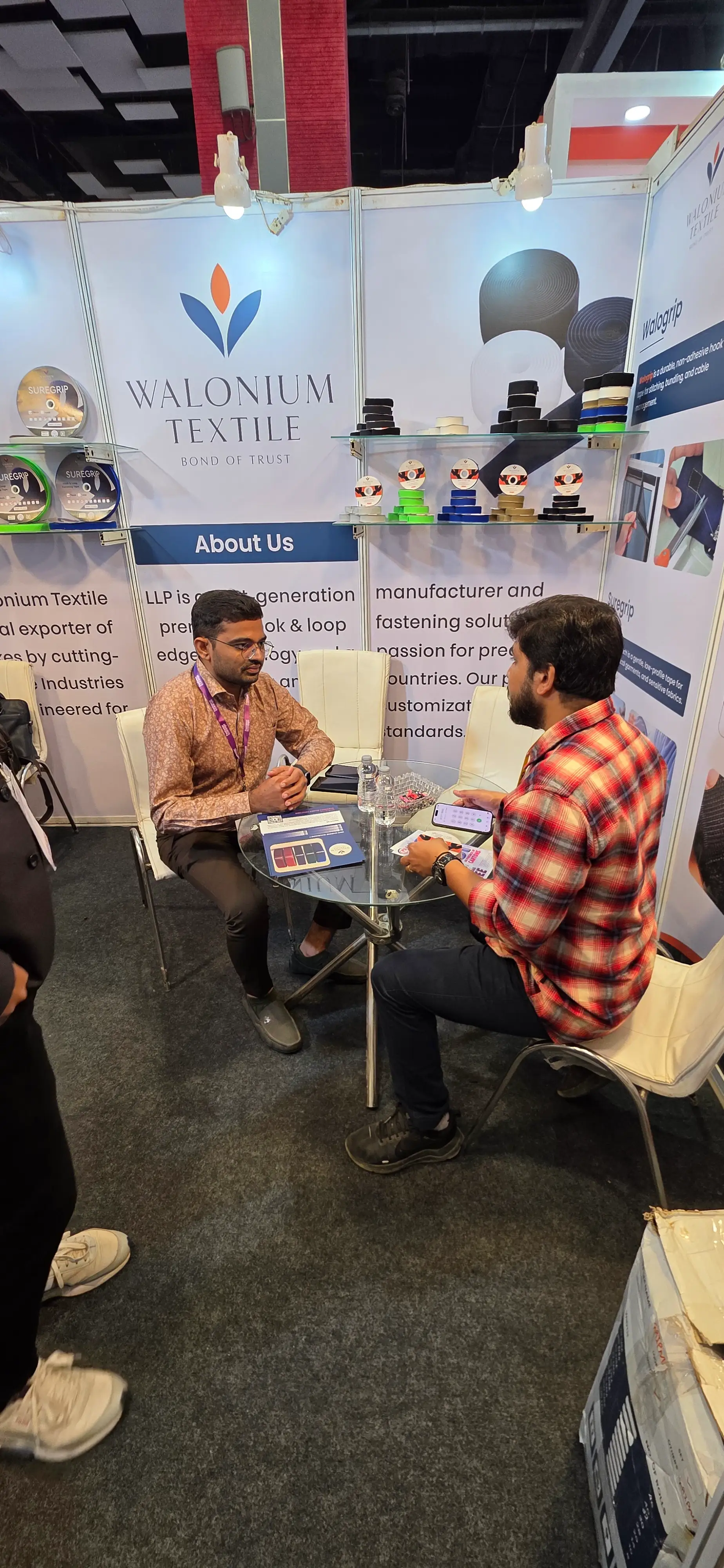 Walonium Textile team welcoming visitors at exhibition